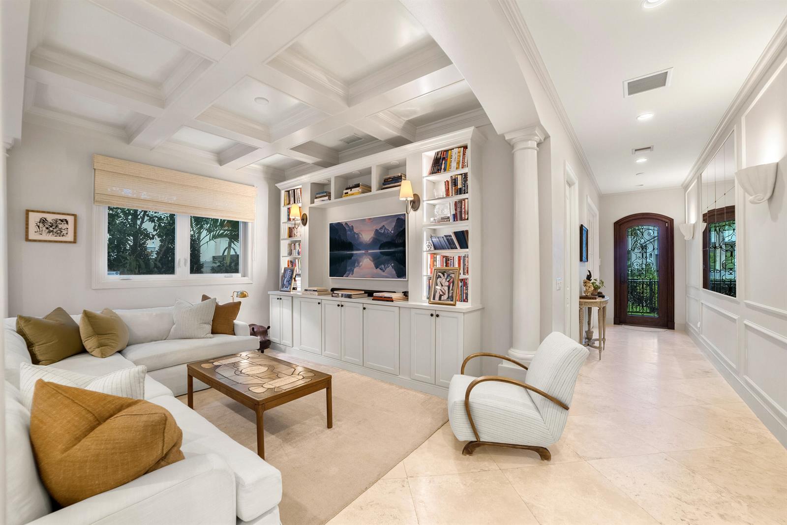 A living room features a coffered ceiling, built-in shelving, a television, and tile flooring — 229 Edmor Road, West Palm Beach FL 33405, WEST PALM BEACH, FL