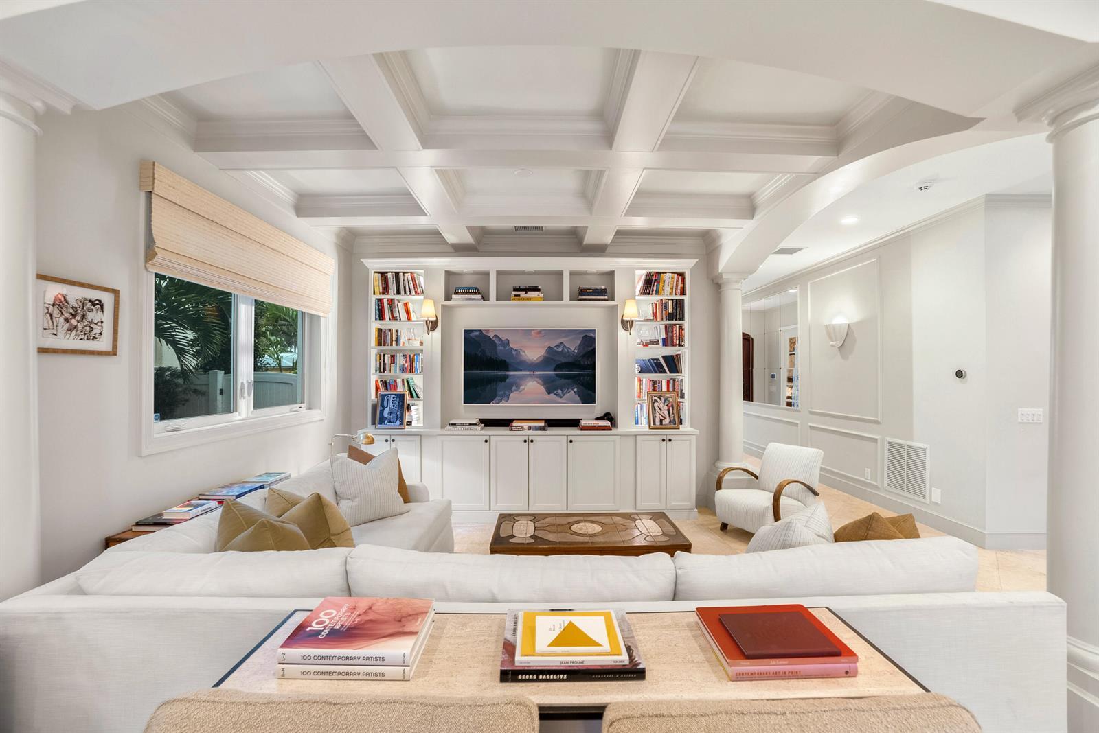A living room with a coffered ceiling, built-in bookshelves, a television, and a sectional sofa — 229 Edmor Road, West Palm Beach FL 33405, WEST PALM BEACH, FL
