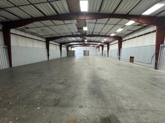 A large, empty industrial warehouse space with a concrete floor and metal walls — 2251 TOPLINE WAY UNIT 5, BROOKSVILLE, FL