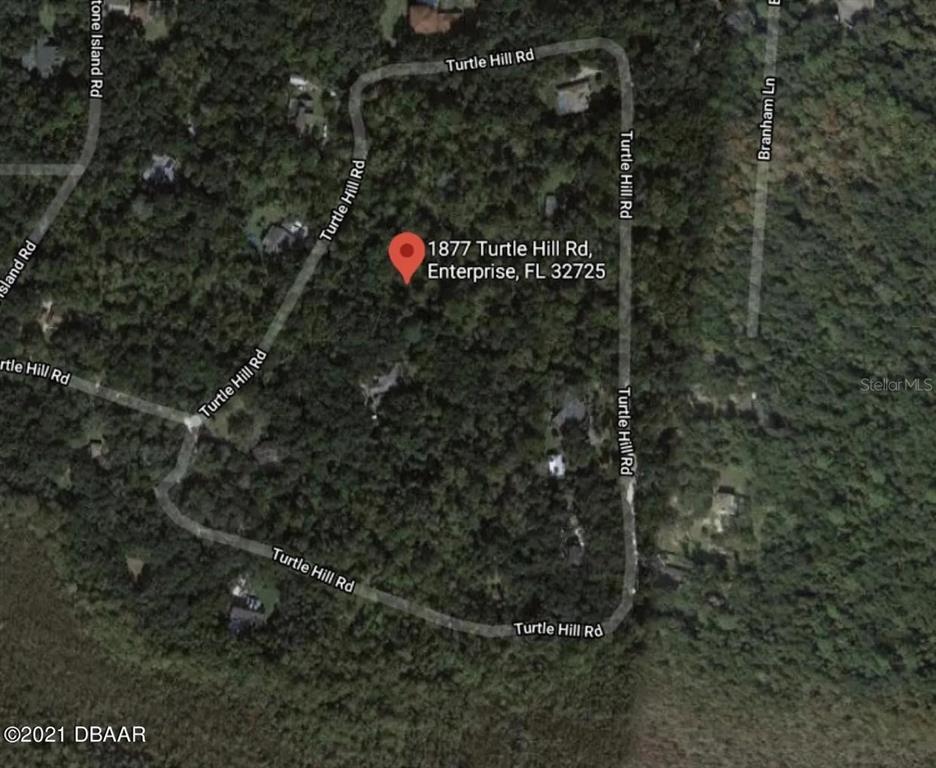 This is a satellite map view of a wooded residential lot on Turtle Hill Road — 1877 TURTLE HILL ROAD, DELTONA, FL