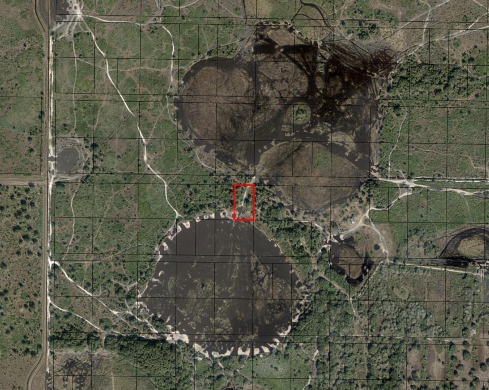 This aerial map shows a rectangular plot of land highlighted in red near several ponds — 0 NW 304th Street, Okeechobee FL 34972, OKEECHOBEE, FL