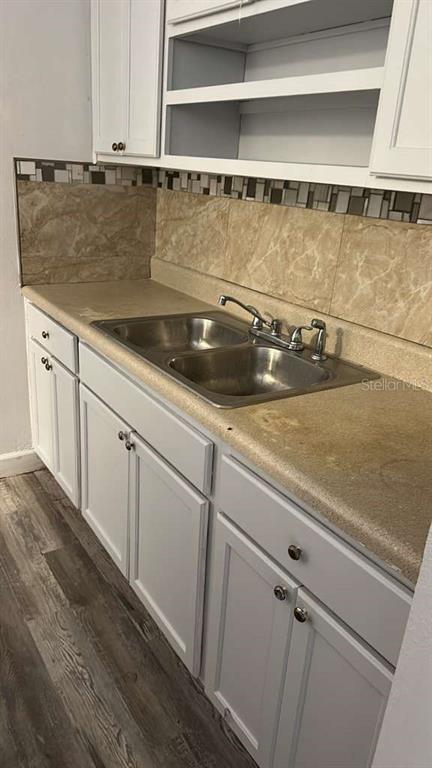 A kitchen sink with a double basin and faucet sits in a beige laminate countertop — 7731 UDINE AVENUE, ORLANDO, FL