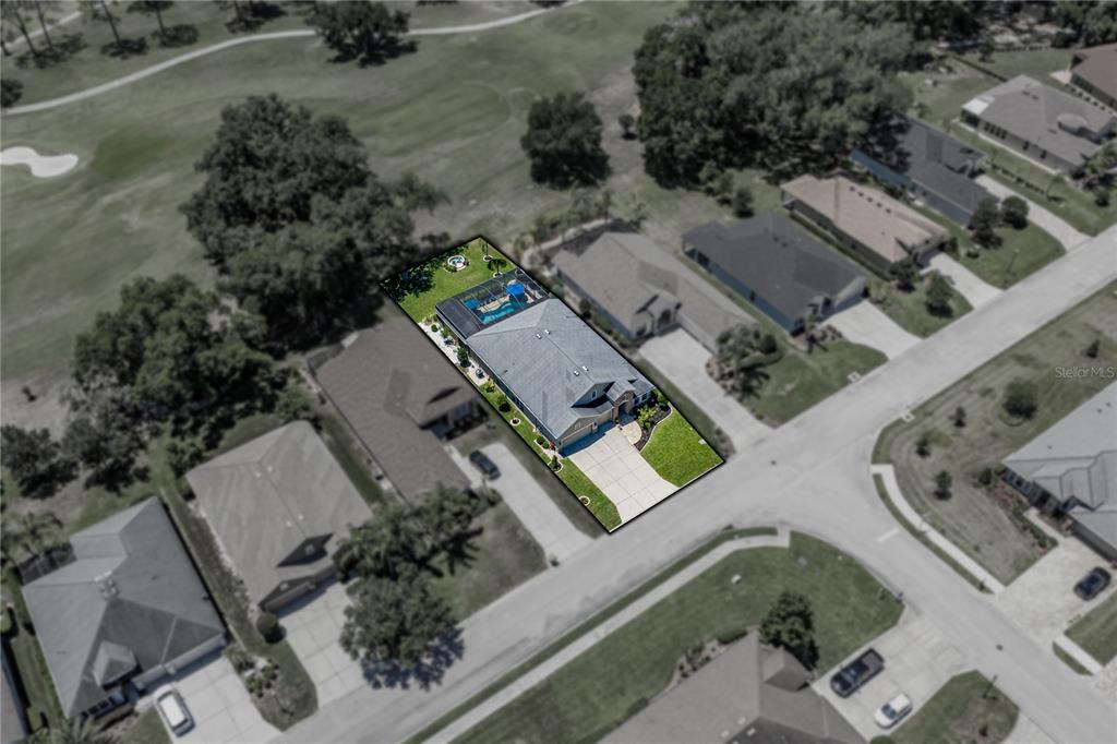 An aerial view shows a single-family house with a pool and screened lanai — 34530 HEAVENLY LANE, DADE CITY, FL