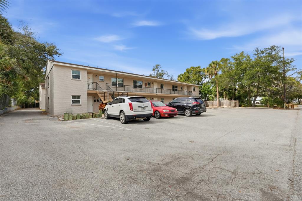 A two-story apartment building with a parking lot in front and several parked cars — 805 LOUISVILLE STREET, PORT ORANGE, FL