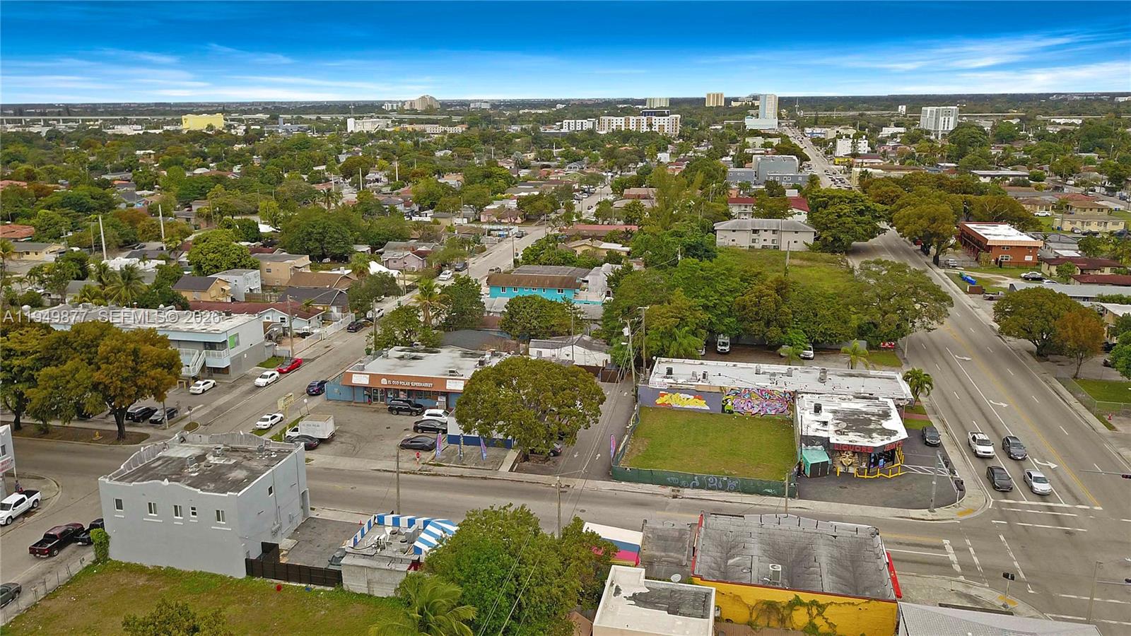 An aerial view shows a commercial area with buildings, parking lots, and surrounding residential streets — 2219 NW 28th St, Miami FL 33142, MIAMI, FL