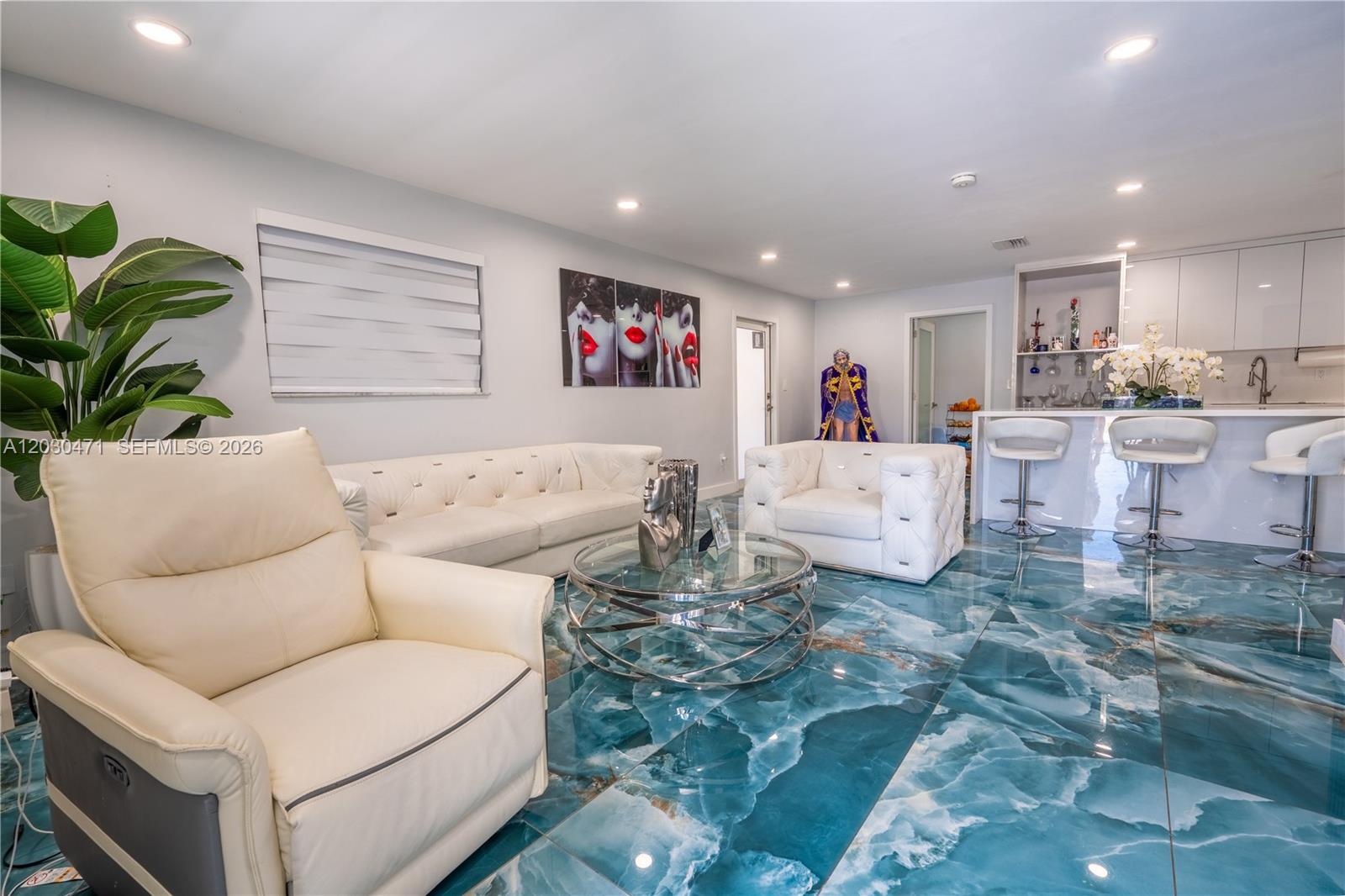 A living room features white leather furniture, a glass coffee table, and blue marble flooring — 11851 SW 181st St, Miami FL 33177, MIAMI, FL