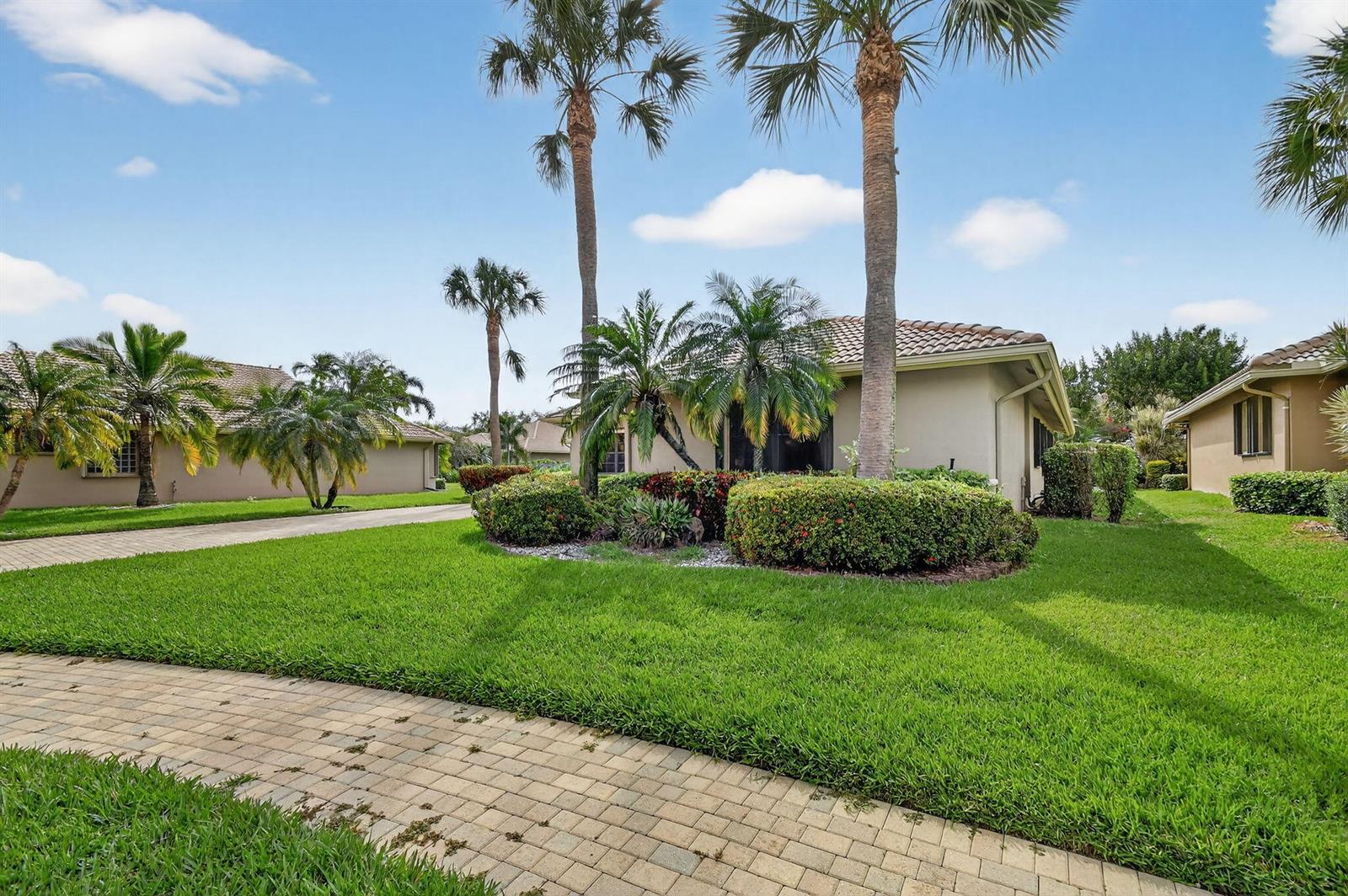 A single-story house with a tiled roof, palm trees, and a paved walkway on grass — 8046 Via Grande, Boynton Beach FL 33437, BOYNTON BEACH, FL