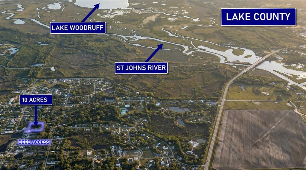 An aerial view shows a 10-acre property near Lake Woodruff and the St. Johns River — 0000 BEAR LAKE BOULEVARD, DELAND, FL