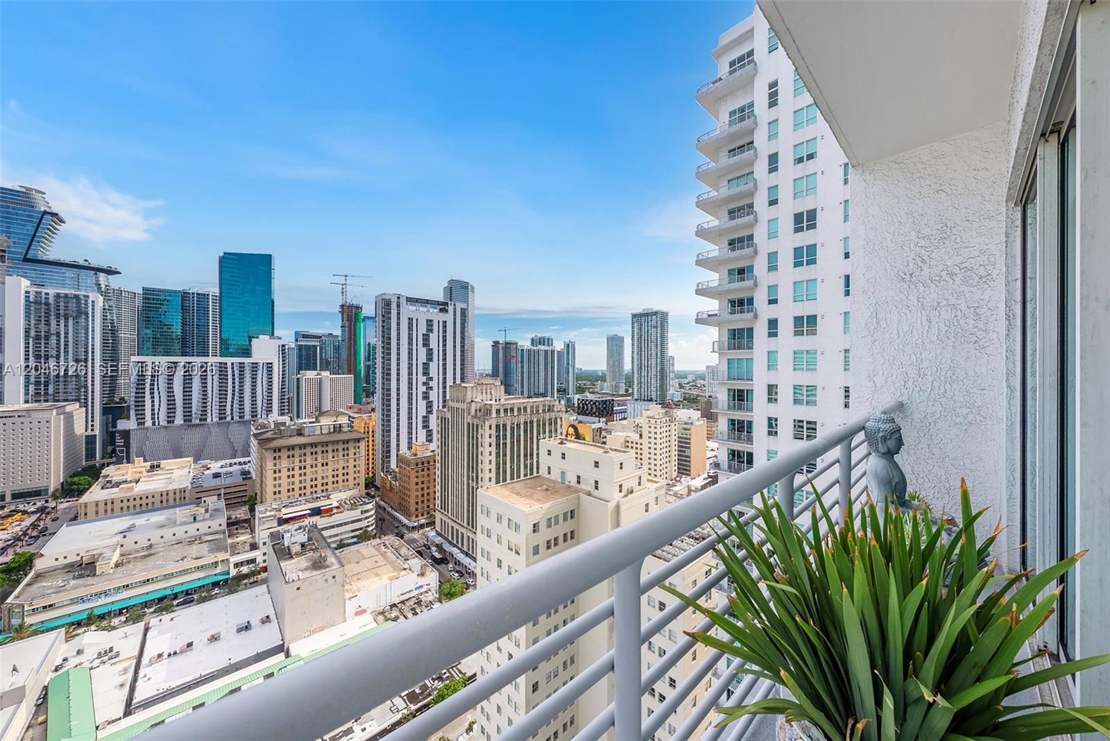An elevated view of a city skyline, a bay, a Ferris wheel, and surrounding buildings — 133 NE 2nd Ave # 2702, Miami FL 33132, MIAMI, FL