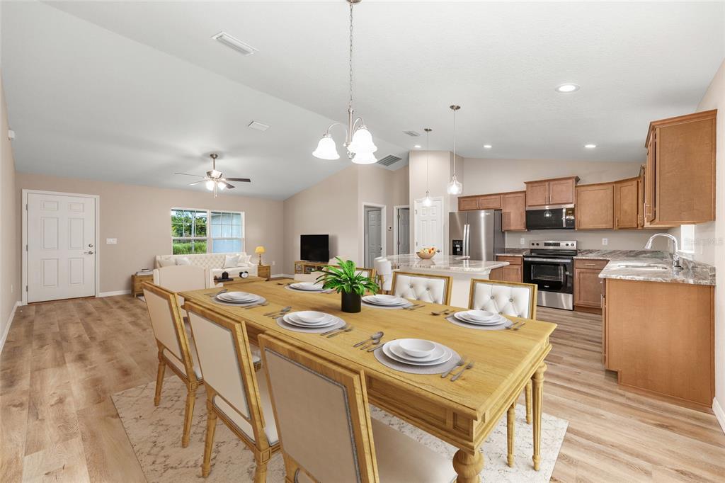 A single-story house with a two-car garage and a concrete driveway sits on a lawn — 5676 N SUMMERFIELD POINT, CITRUS SPRINGS, FL