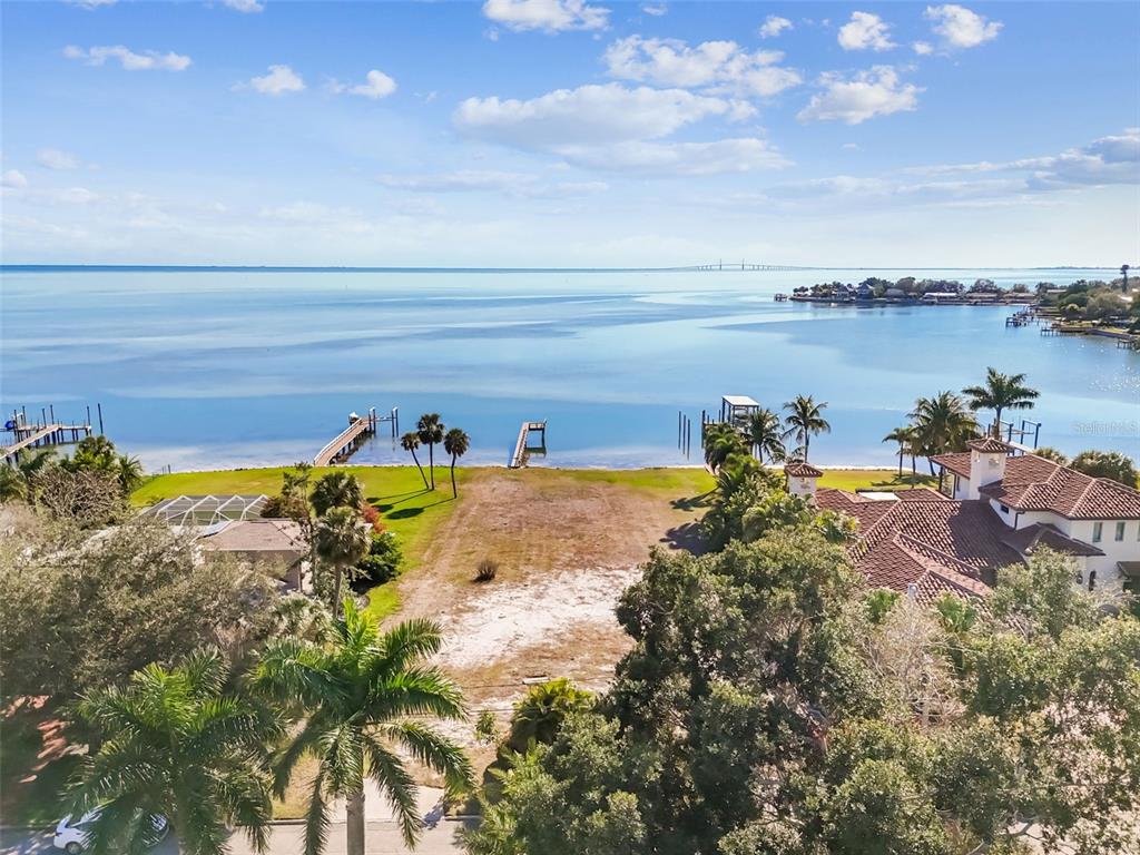 An aerial view of a waterfront lot with a dock and surrounding houses — 6330 BAHAMA SHORES DRIVE S, ST PETERSBURG, FL