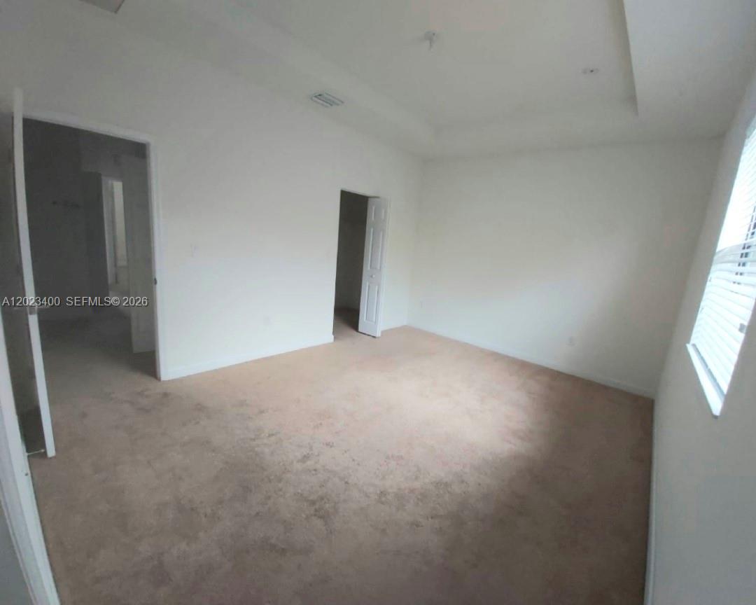 A kitchen features light wood cabinets, granite countertops, and stainless steel appliances — 9261 W 33rd Way, Hialeah FL 33018, HIALEAH, FL