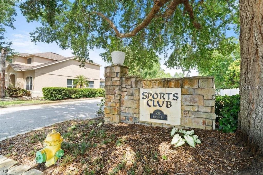 A yellow single-story house features an arched entryway, a decorative front door, and arched windows — 1510 GAYNOR COURT, DELTONA, FL