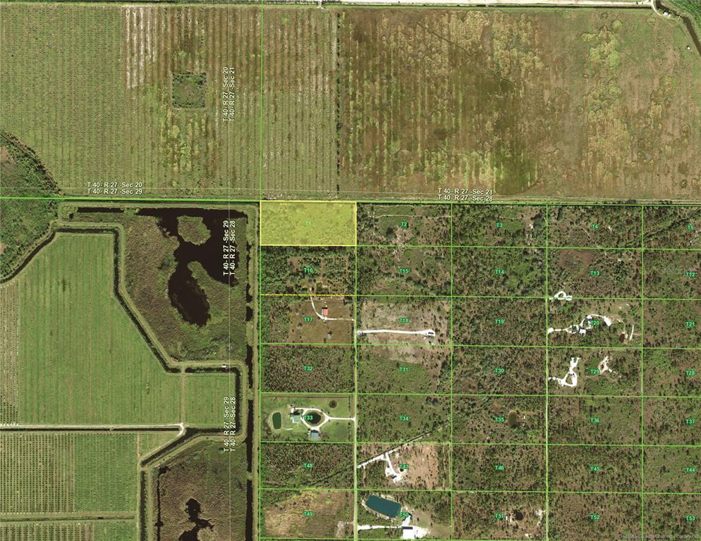 This is an aerial map showing a highlighted rectangular land parcel within a rural grid — 50032 BERMONT ROAD, PUNTA GORDA, FL