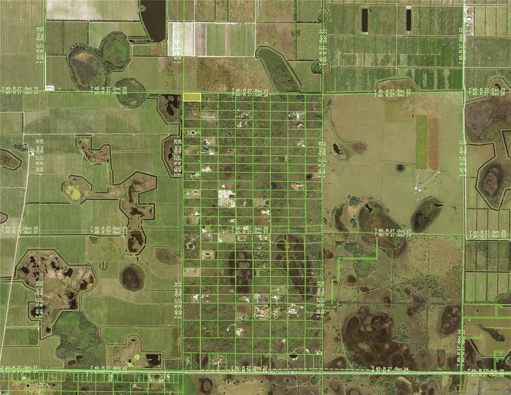 This is an aerial map showing land parcels with property lines overlaid on a rural landscape — 50032 BERMONT ROAD, PUNTA GORDA, FL