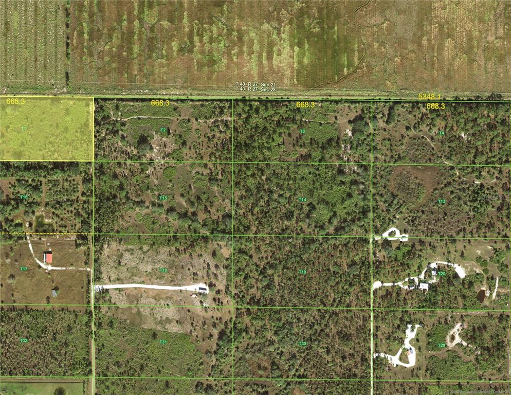 This is an aerial map showing a grid of land parcels with vegetation and structures — 50032 BERMONT ROAD, PUNTA GORDA, FL