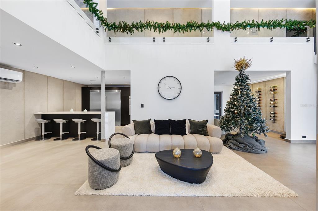 A modern living room features a white sofa, a black coffee table, and a Christmas tree — NN1 CALLE NACAR, DORADO DEL MAR, DORADO, PR