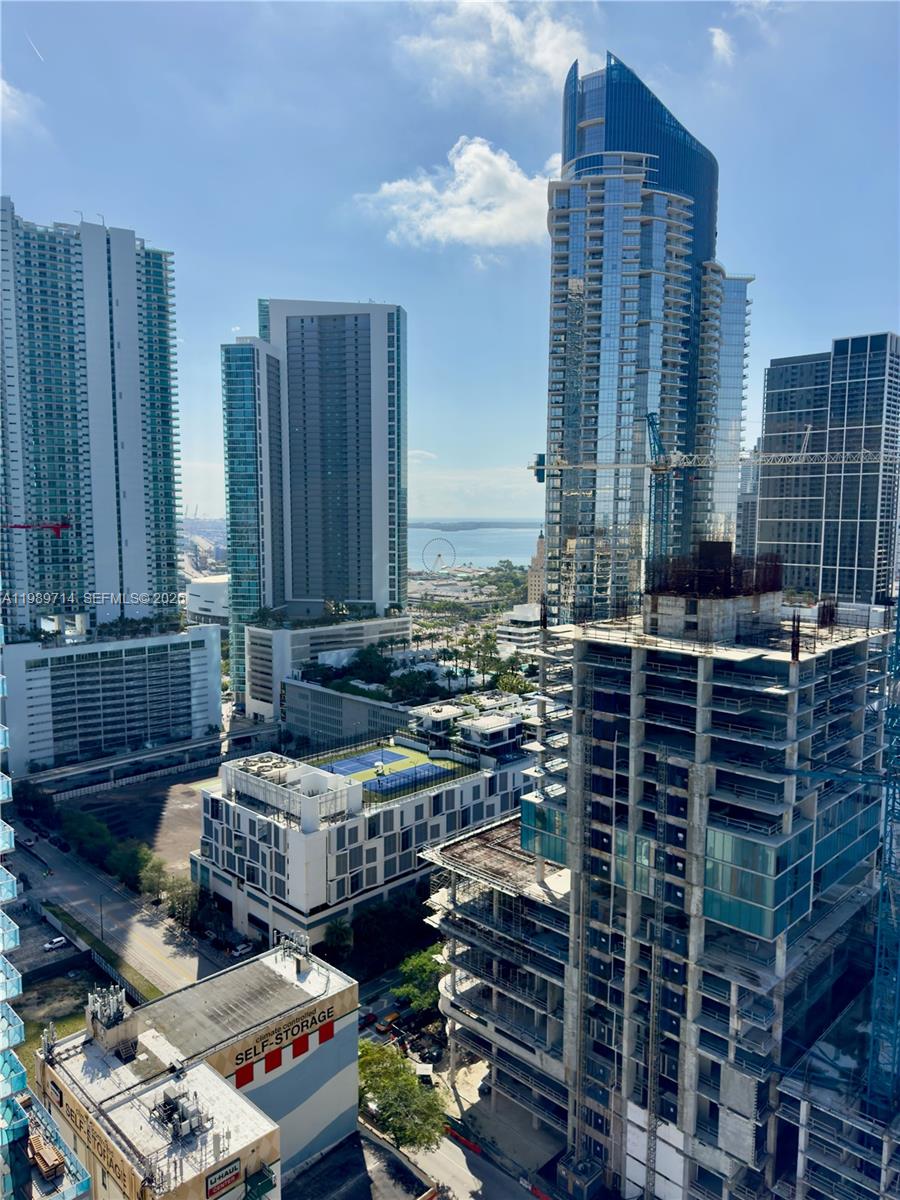 An elevated view shows a dense urban skyline with high-rise buildings and active construction sites — 20 NE 11th St # 3006A, Miami FL 33132, MIAMI, FL