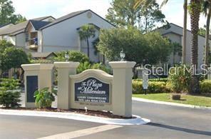 An exterior view of the entrance sign for The Plaza at Millenium condominium complex — 1948 LAKE ATRIUMS CIRCLE UNIT 127, ORLANDO, FL