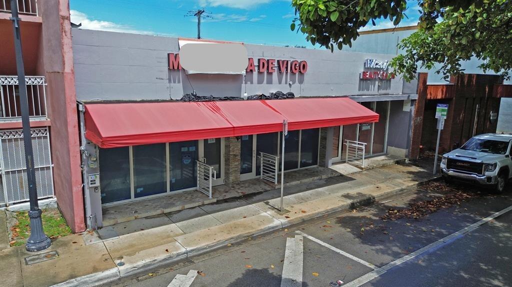 An exterior view of a commercial building with a red awning and glass storefronts — 1365 SW 22nd Street, Miami FL 33145, MIAMI, FL