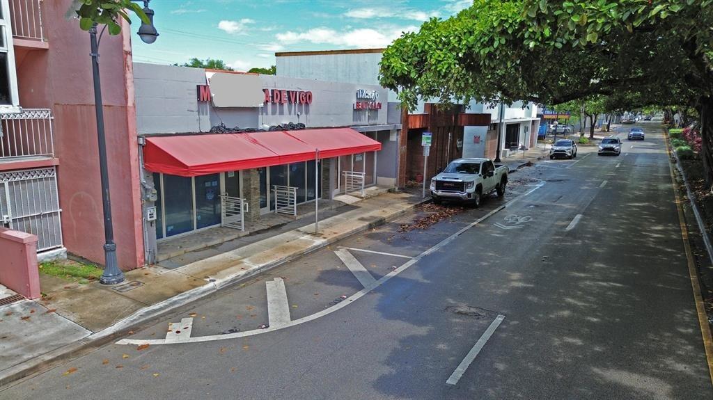 An exterior view of a commercial building with a red awning along a city street — 1365 SW 22nd Street, Miami FL 33145, MIAMI, FL