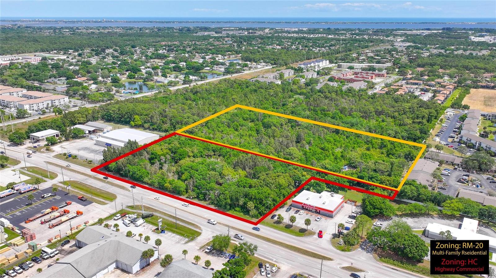 An aerial view shows two adjacent plots of land outlined in red and yellow — 4527 S Babcock Street, Palm Bay FL 32905, PALM BAY, FL