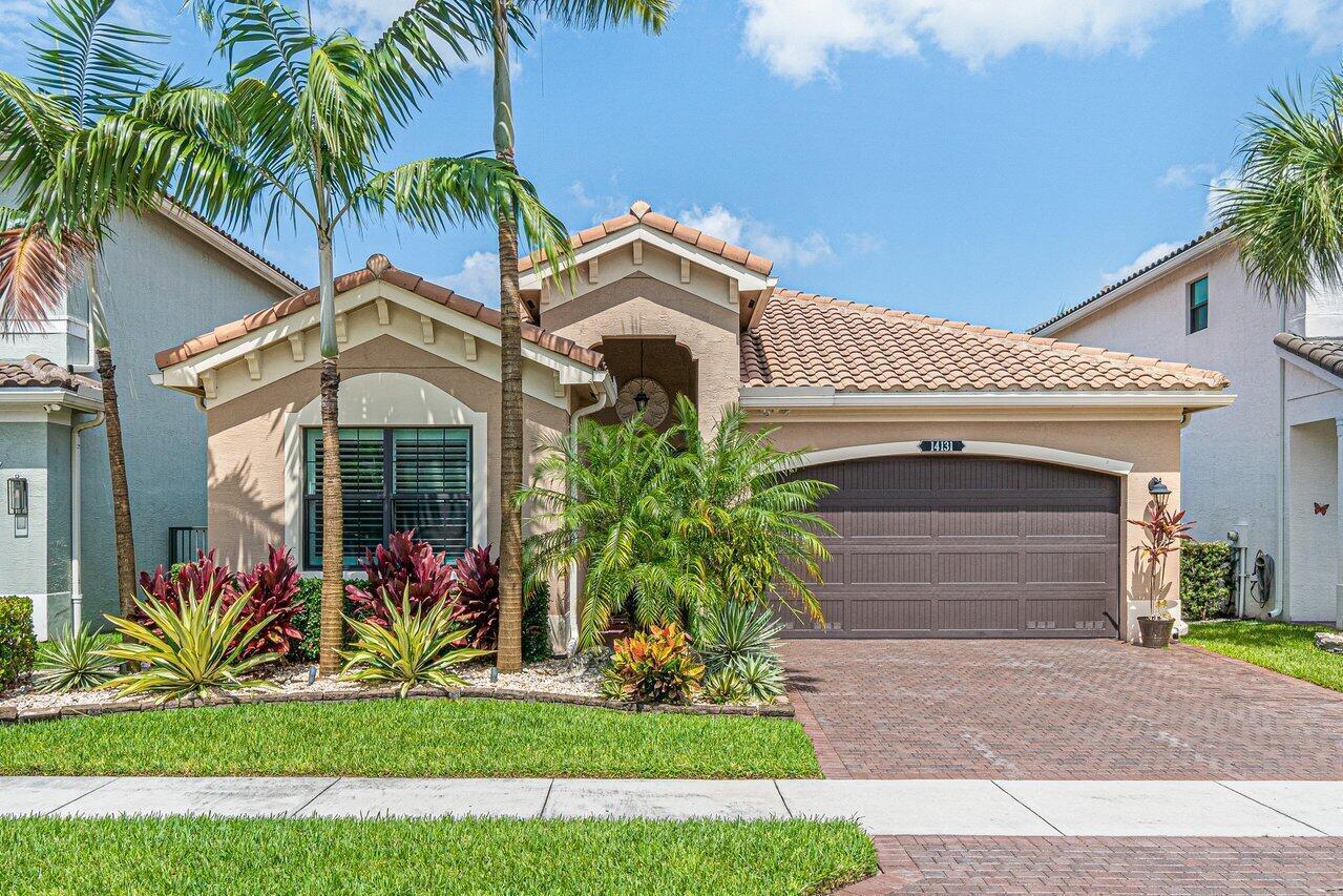 A single-story house with a brown garage, tile roof, and tropical landscaping in the front — 14131 Rock Salt Road, Delray Beach FL 33446, DELRAY BEACH, FL