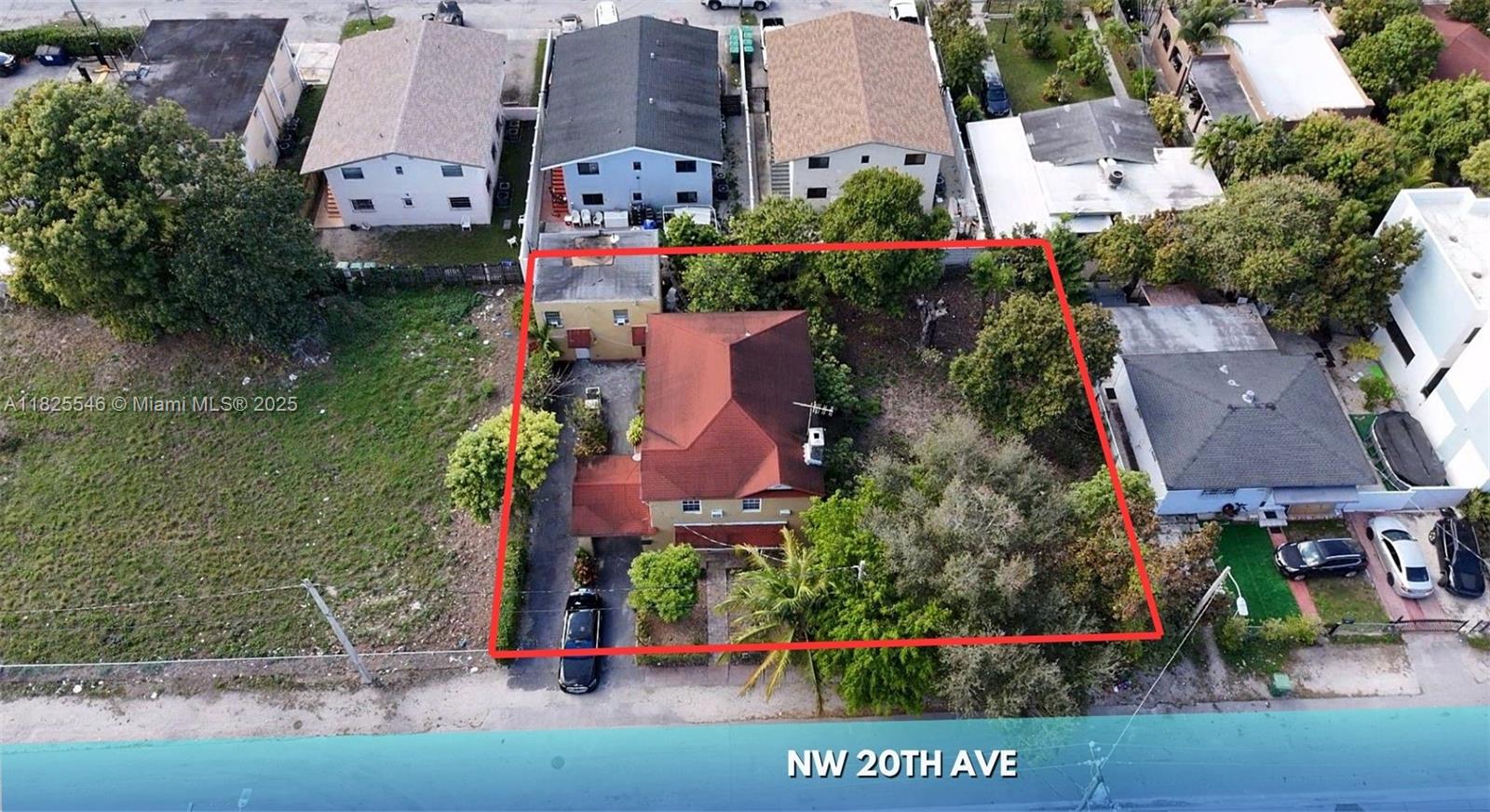An aerial view shows a house with a red roof and a large backyard — 3660 NW 20th Ave, Miami FL 33142, MIAMI, FL
