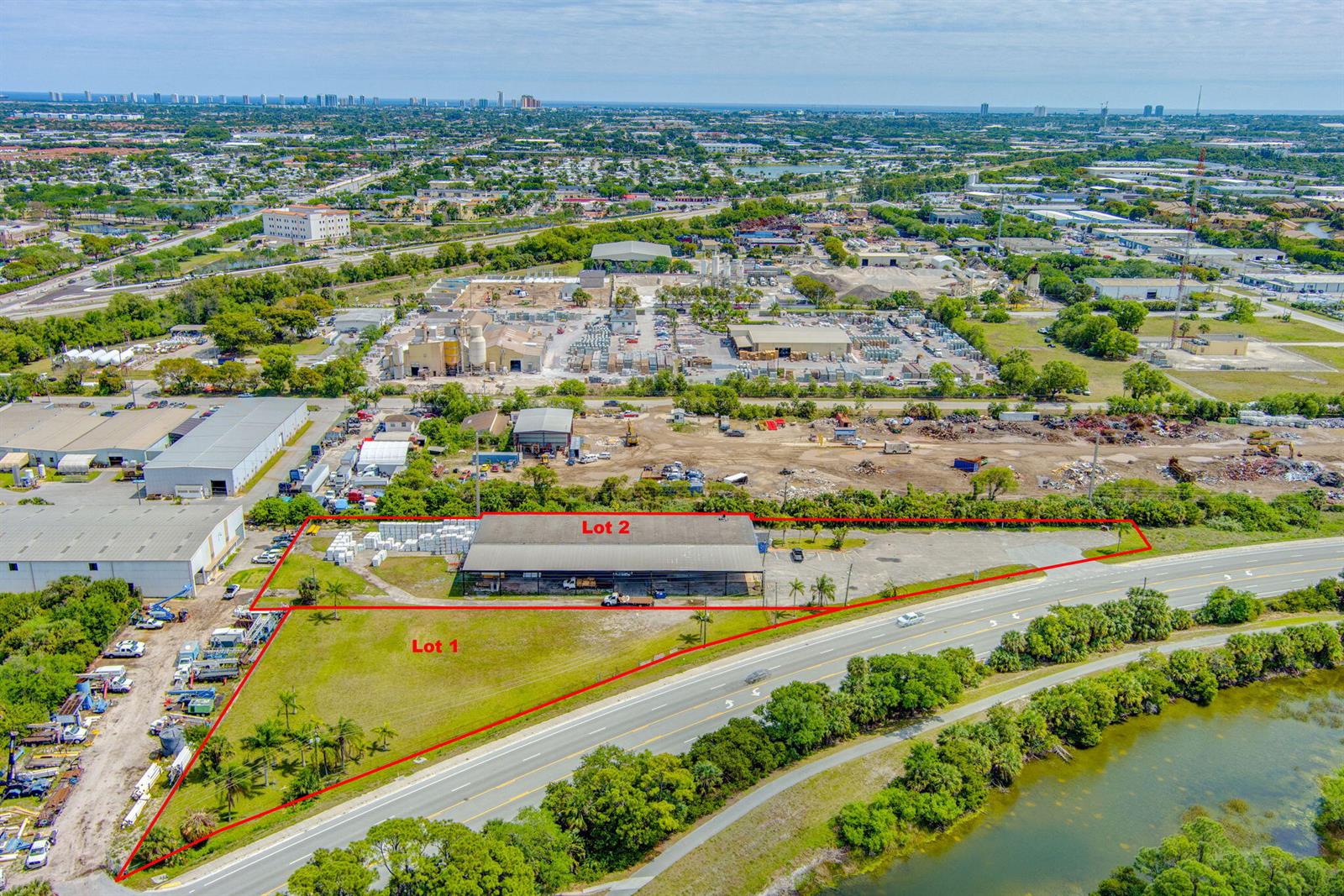 An aerial view shows two adjacent commercial lots with a warehouse and paved parking area — 7030 Haverhill Road, Riviera Beach FL 33407, RIVIERA BEACH, FL
