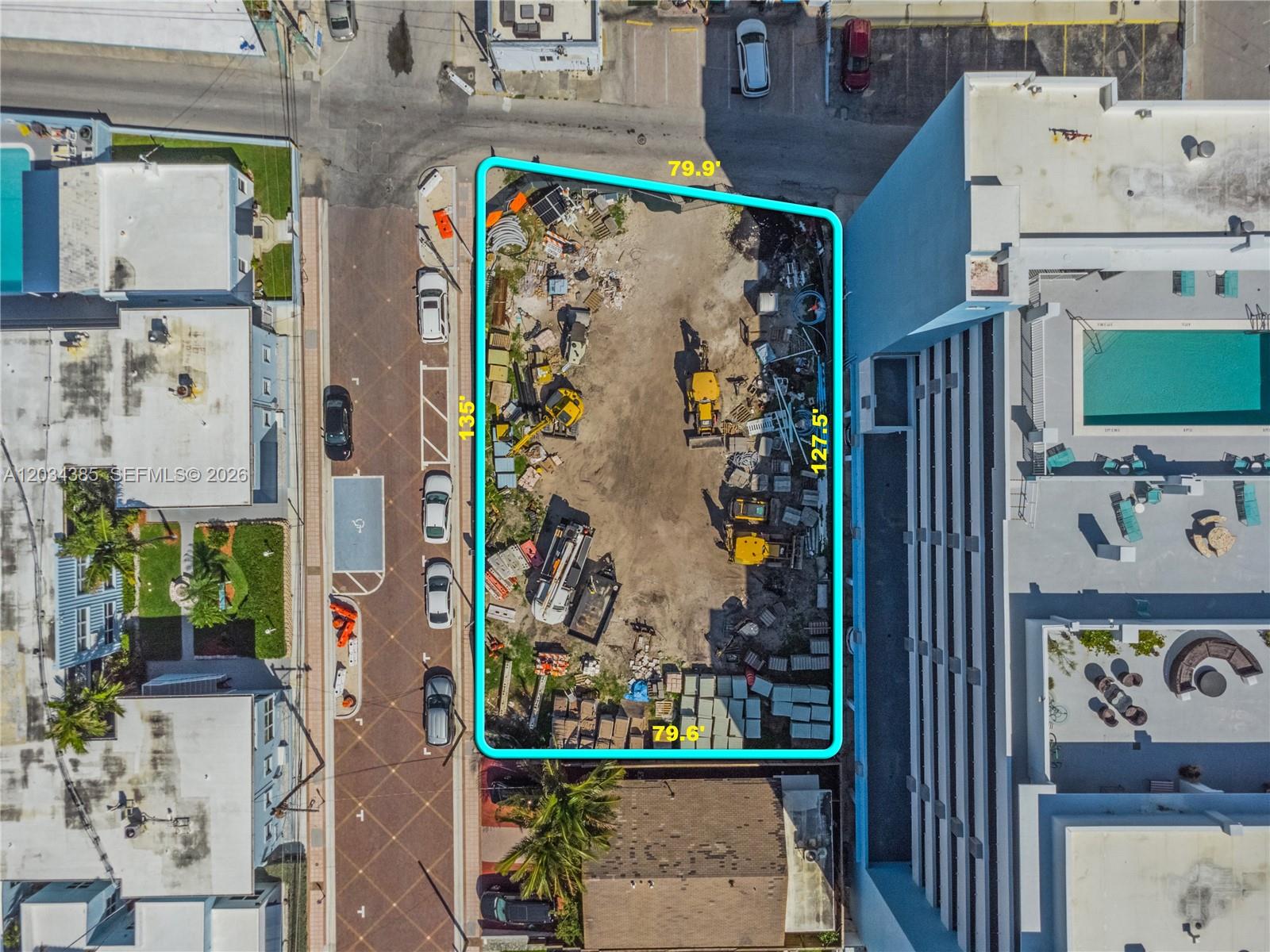 This aerial view shows a vacant, rectangular lot marked by a blue boundary line — 300 Van Buren St, Hollywood FL 33019, HOLLYWOOD, FL