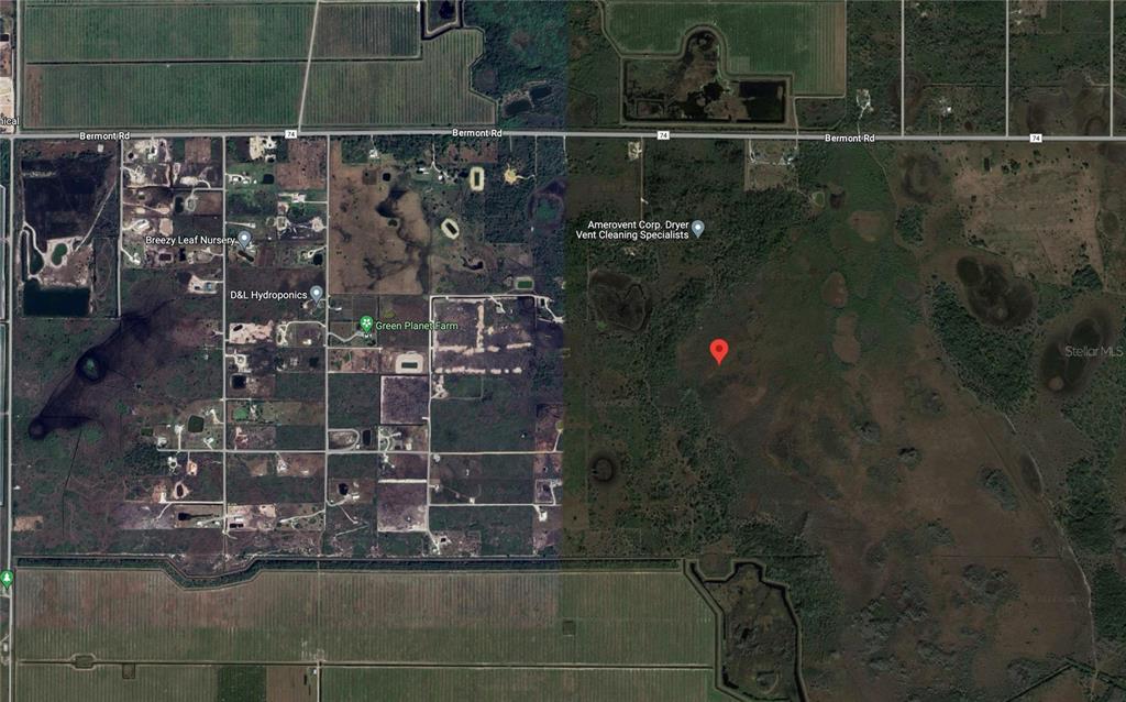 This is an aerial map view showing a rural area with roads, vegetation, and structures — 49667 BERMONT ROAD, PUNTA GORDA, FL