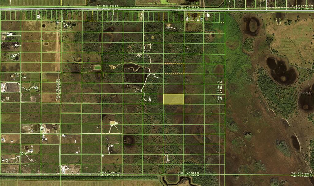 An aerial map shows a highlighted rectangular land parcel within a grid of rural lots — 49667 BERMONT ROAD, PUNTA GORDA, FL