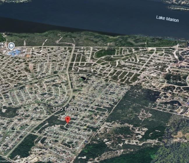 This is an aerial map view showing a residential neighborhood near Lake Marion — 1705 TENCH LANE, KISSIMMEE, FL