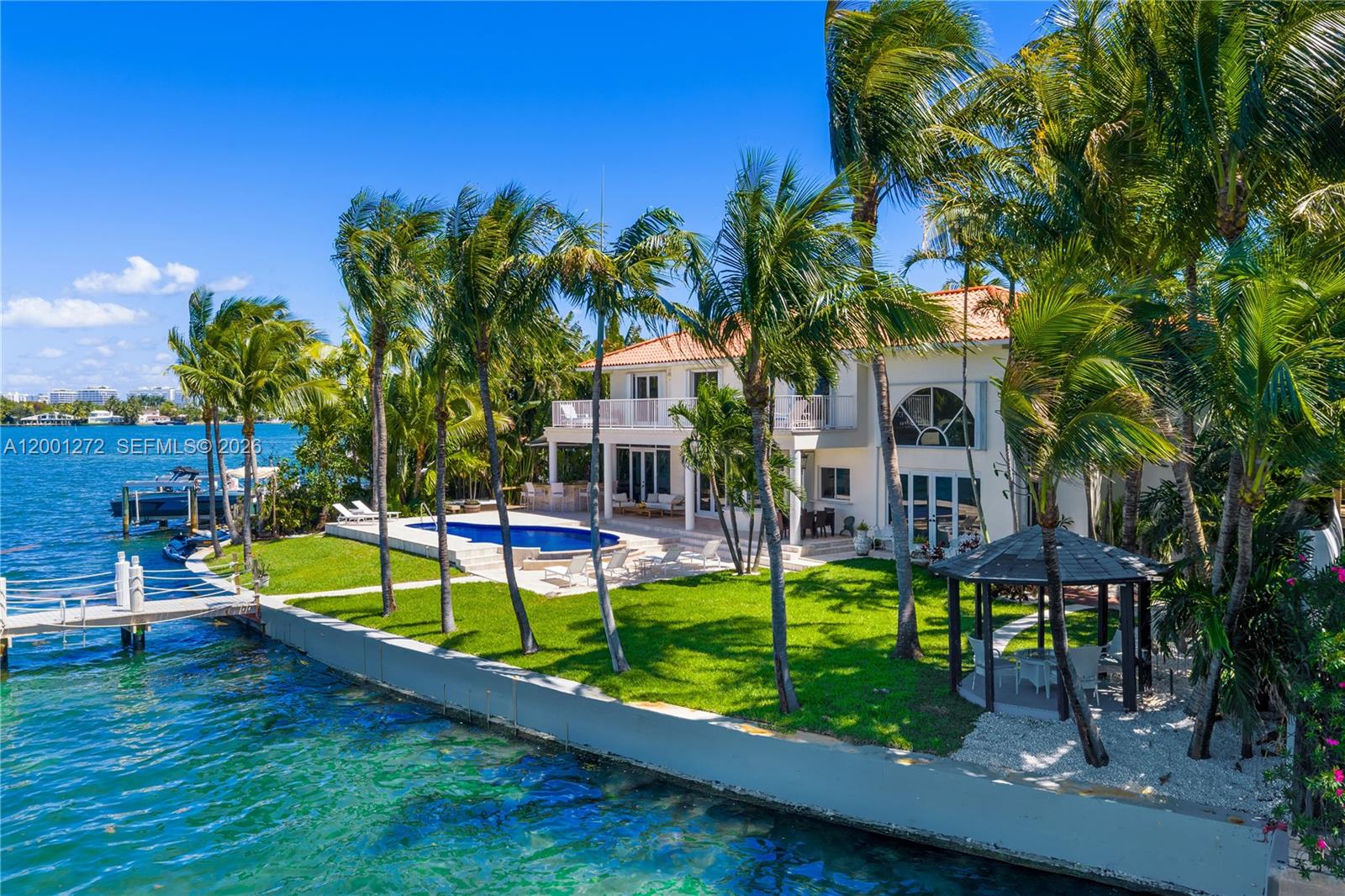 An aerial view of a waterfront house with a pool, lawn, and gazebo — 1575 Stillwater Dr, Miami Beach FL 33141, MIAMI BEACH, FL