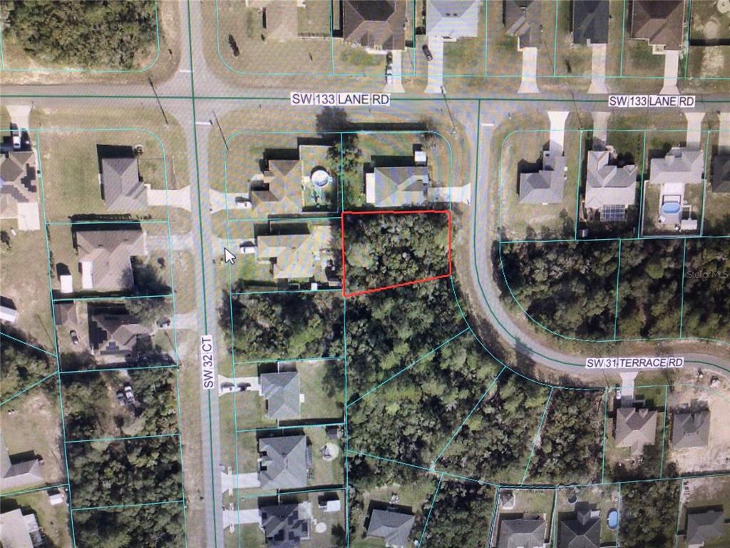 This is an aerial map showing a vacant, wooded residential lot outlined in red — 0 SW 31 TERRACE ROAD, OCALA, FL