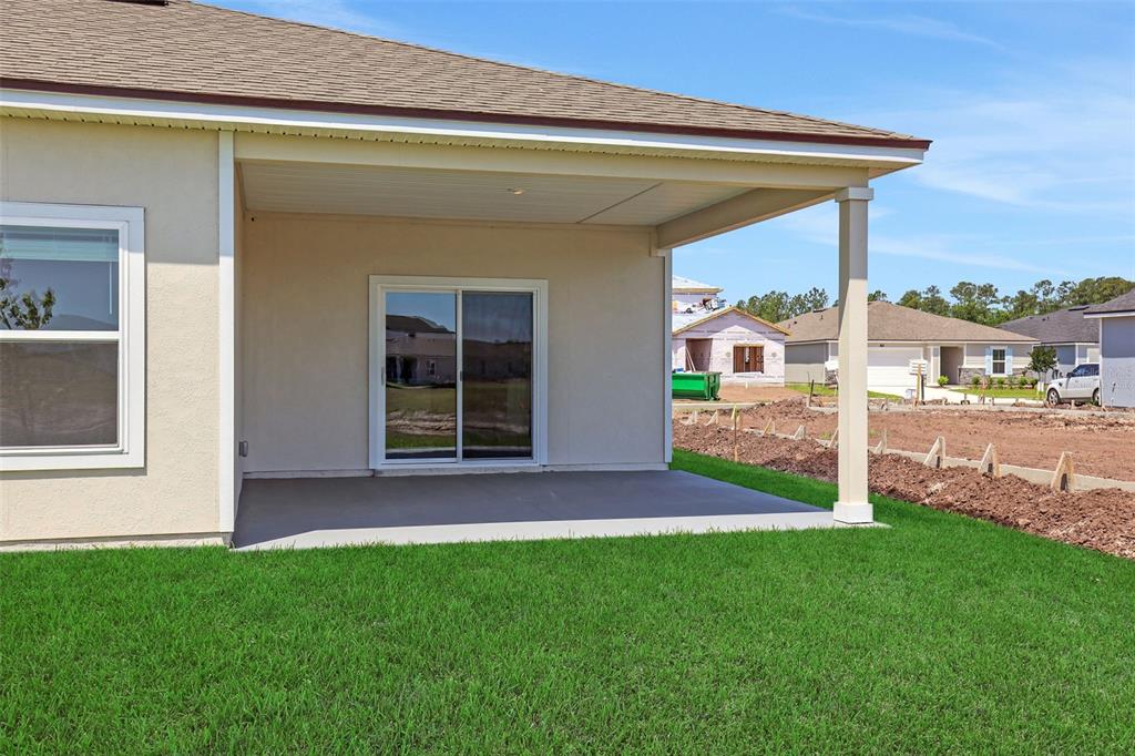 A bedroom with white walls, beige carpet, recessed lighting, and a window with blinds — 5700 LAGOON CRUISE WAY, JACKSONVILLE, FL
