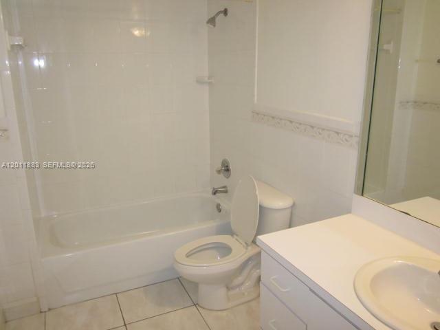 A bathroom features a white bathtub, a toilet, and a vanity with a sink — 8201 NW 8th St # 414, Miami FL 33126, MIAMI, FL