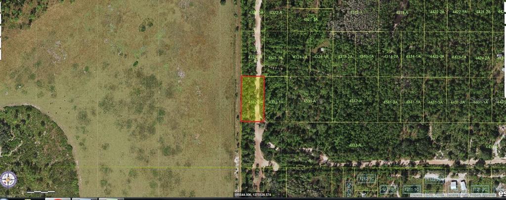 This aerial map shows a rectangular parcel of land highlighted in red along a dirt road — HOLOPAW GROVES ROAD, ST CLOUD, FL