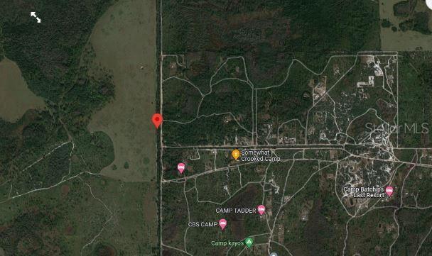 This is a satellite map view showing a wooded area with several marked camp locations — HOLOPAW GROVES ROAD, ST CLOUD, FL
