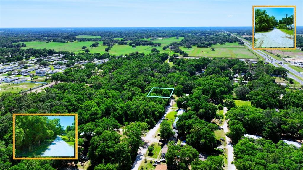 An aerial view shows a wooded lot highlighted in blue, surrounded by rural landscape — TBD SW 2ND PLACE, OCALA, FL