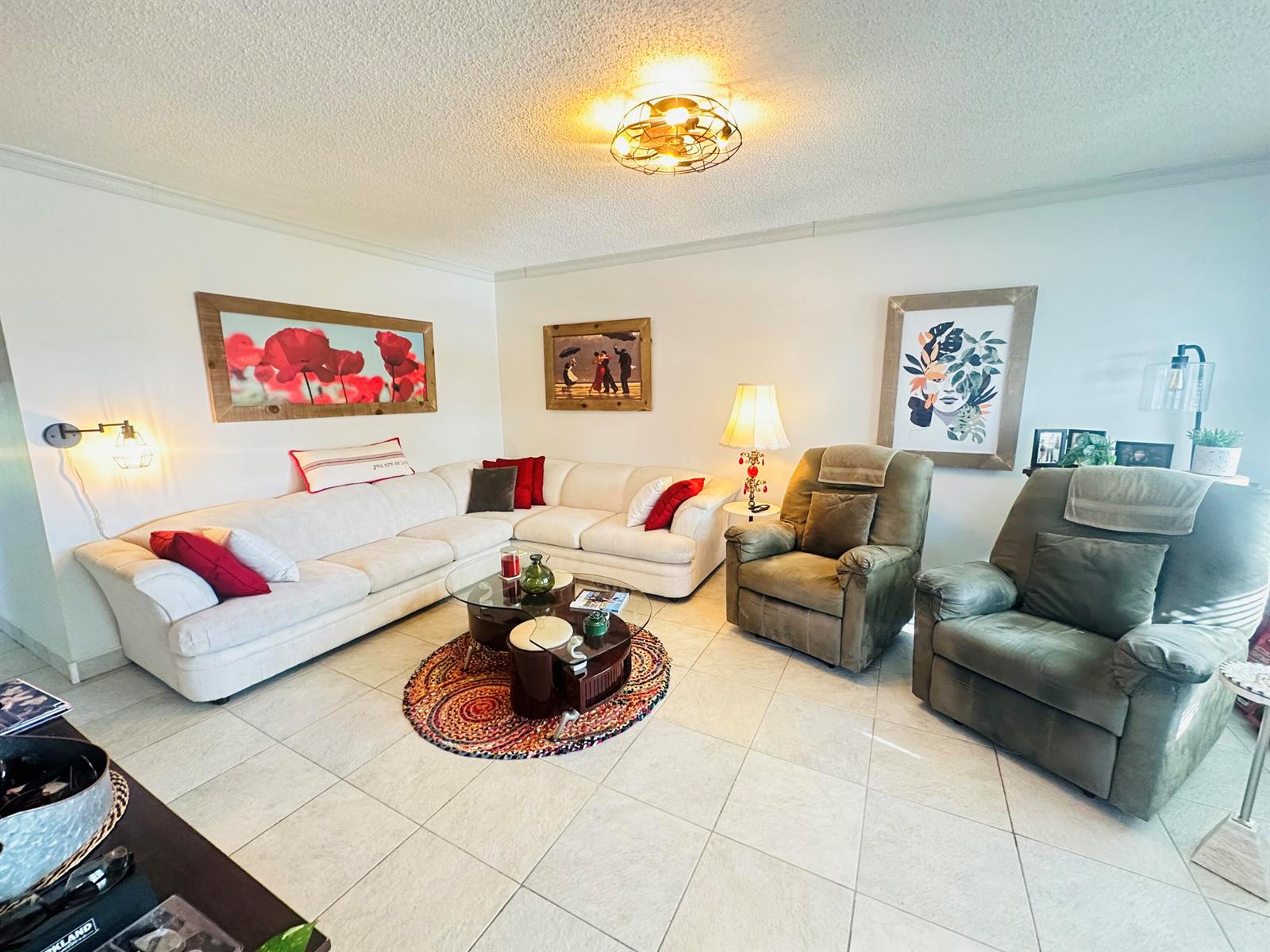 A living room features a white sectional sofa, two recliners, a coffee table, and wall art — 200 Ventnor L # 200, Deerfield Beach FL 33442, DEERFIELD BEACH, FL