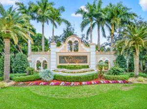 A stone entrance sign for Villaggio surrounded by palm trees and manicured landscaping — 6504 Pisano Drive # 6504, Lake Worth FL 33467, LAKE WORTH, FL