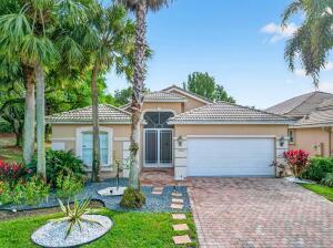 A single-story house with a beige stucco exterior, a tiled roof, and a brick driveway — 6504 Pisano Drive # 6504, Lake Worth FL 33467, LAKE WORTH, FL