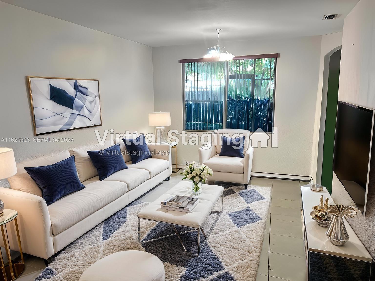 A living room features a white sofa, armchair, patterned rug, and a wall-mounted television — 12414 SW 213th St, Miami FL 33177, MIAMI, FL