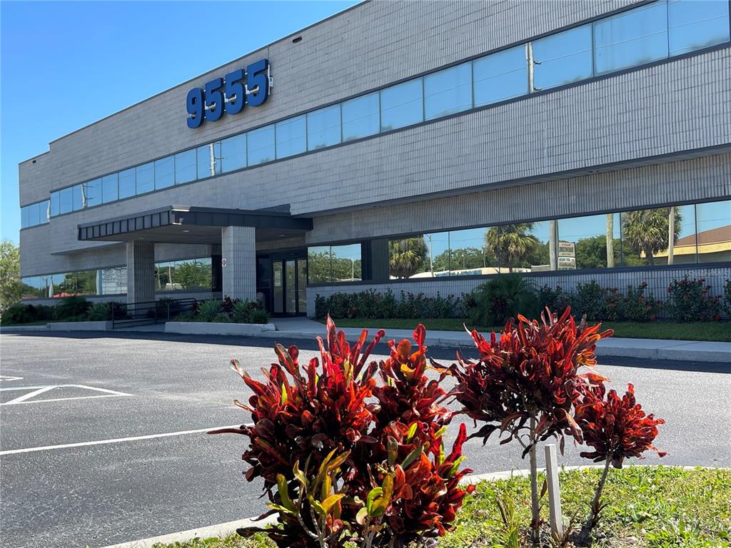A two-story commercial building with a prominent number 9555 on the exterior facade — 9555 SEMINOLE BOULEVARD UNIT 001, SEMINOLE, FL