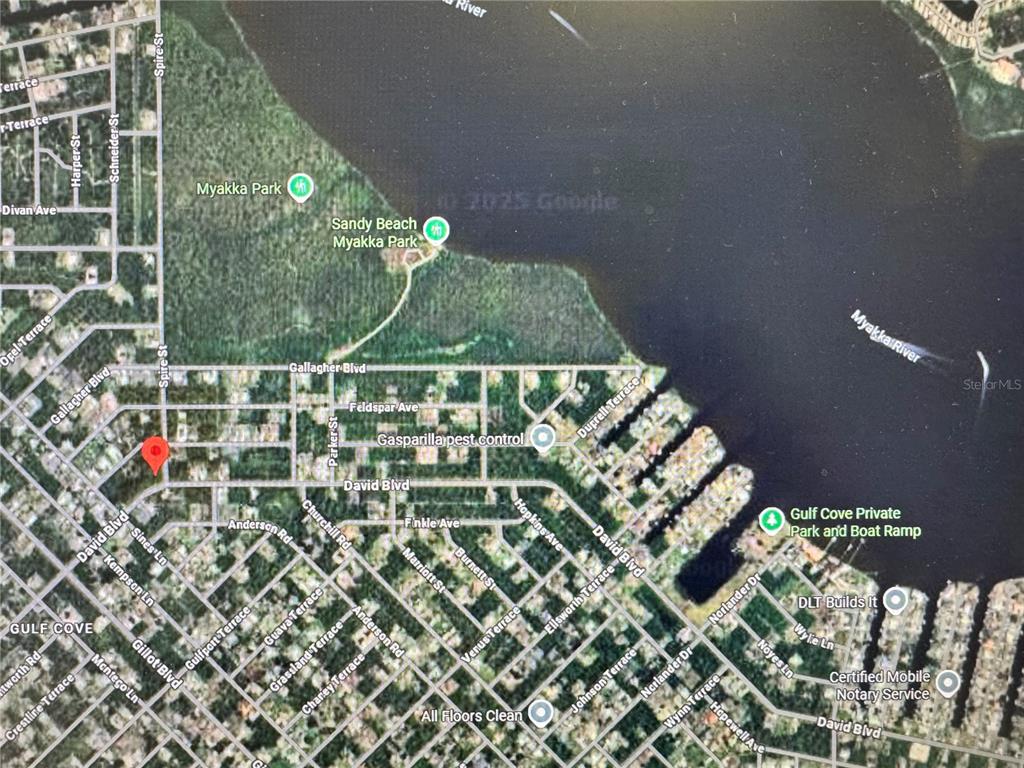 This is a satellite map showing residential streets and the Myakka River in Florida — 4635 SPIRE STREET, PORT CHARLOTTE, FL