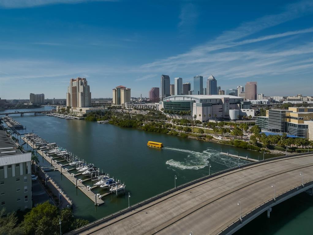 An aerial view of the Tampa skyline, river, marina, and a bridge over the water — 600 GARRISON COVE LANE UNIT 2B, TAMPA, FL