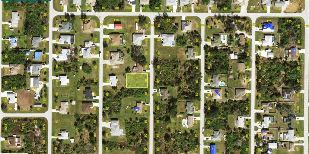 This is an aerial map showing a vacant residential lot highlighted in yellow — 6159 LOMAX STREET, ENGLEWOOD, FL