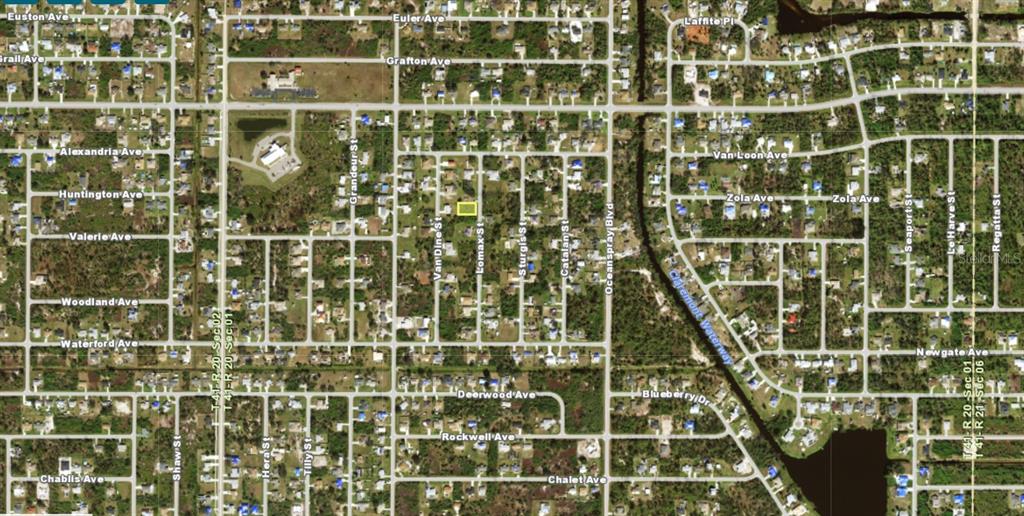 This is an aerial map view of a residential neighborhood with a highlighted vacant lot — 6159 LOMAX STREET, ENGLEWOOD, FL