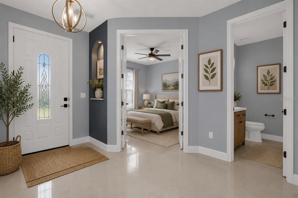 A bright entryway with light gray walls leads to a bedroom and a small bathroom — 1926 MENDOCINO LANE, PORT ORANGE, FL